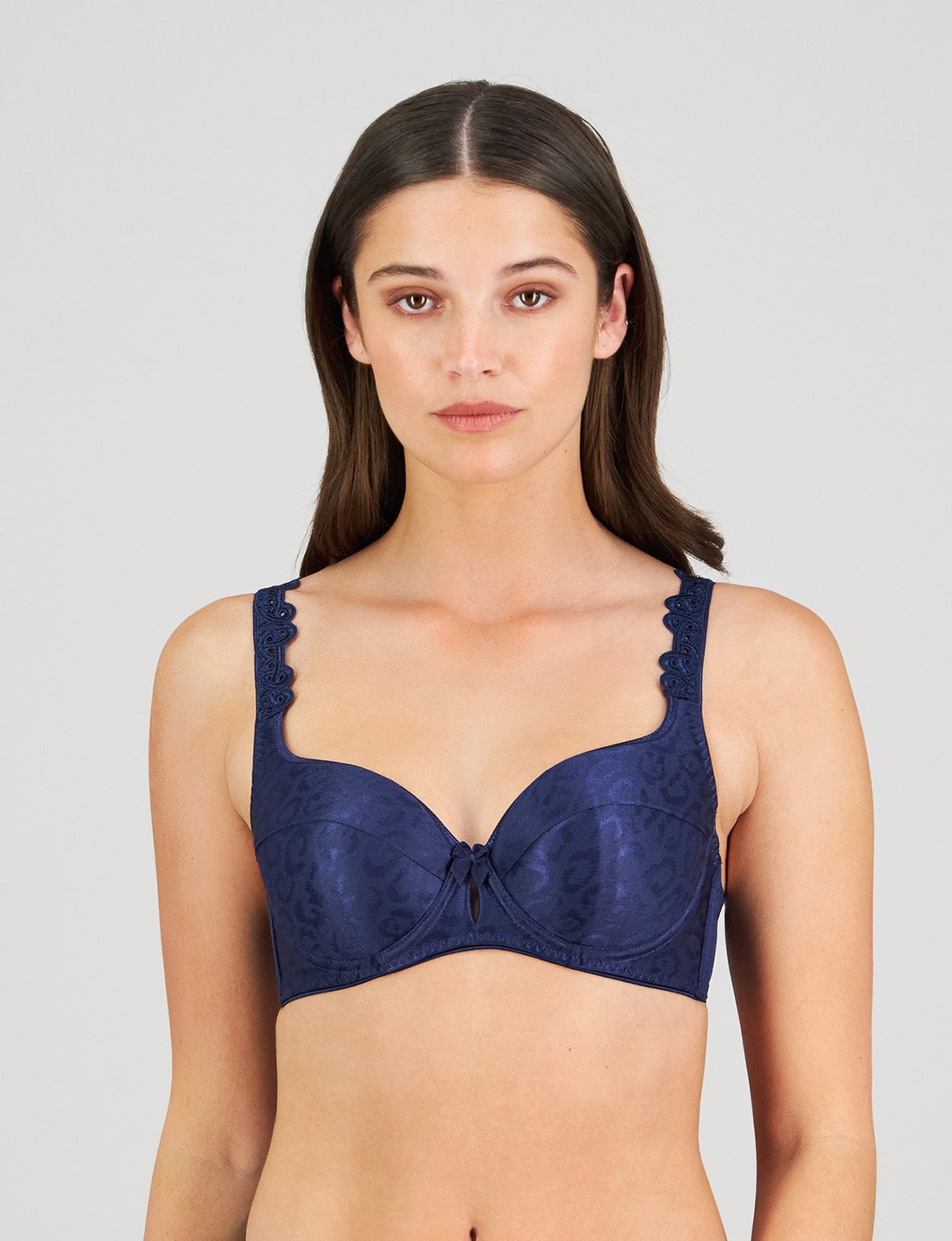 Model wears Damask Contour Bra in Medieval Blue. On body front view