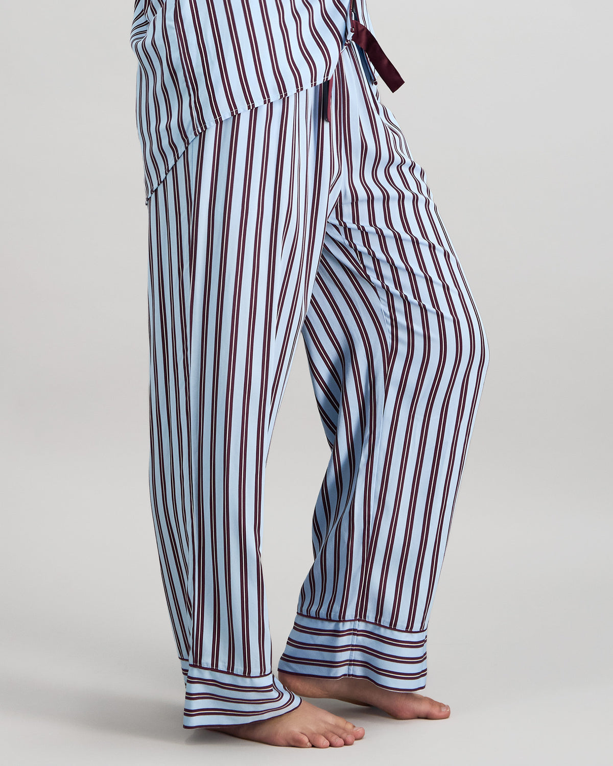 Model wears Cabana Stripe Long Pj Pant in COOL BLUE. On body side view
