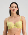 Model wears Elevate Underwire Bra in LEMON MERINGUE. On body front view