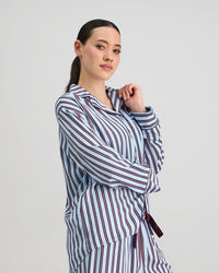 Model wears Cabana Stripe Long Sleeve Pj Top in COOL BLUE. On body side view