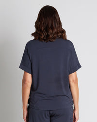 Model wears Sleep-Talk Short Sleeve Top in NIGHT SKY. On body back view