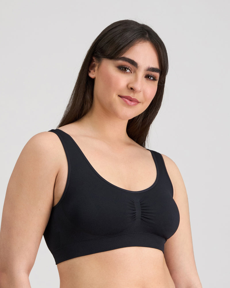 Model wears Bendon Essentials Crop Top in BLACK. On body side view