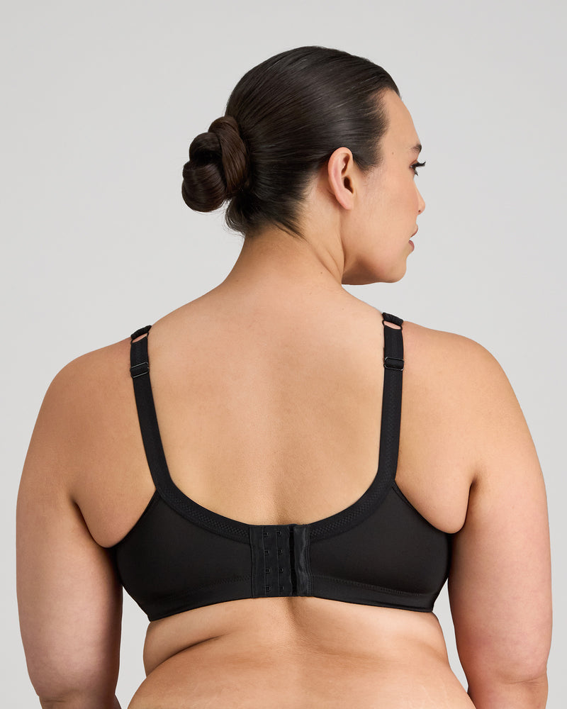 Model wears Bendon Sports Underwire Bra in BLACK. On body back view