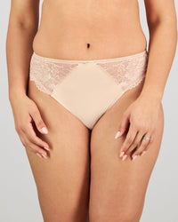 Model wears Laurel High Cut Brief in LATTE. On body front view