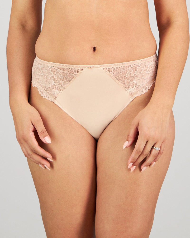 Model wears Laurel High Cut Brief in LATTE. On body front view