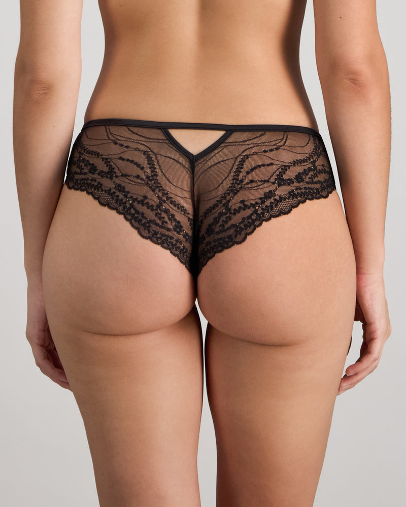Model wears Adaline Brazilian in BLACK FLORAL PRINT. On body back view