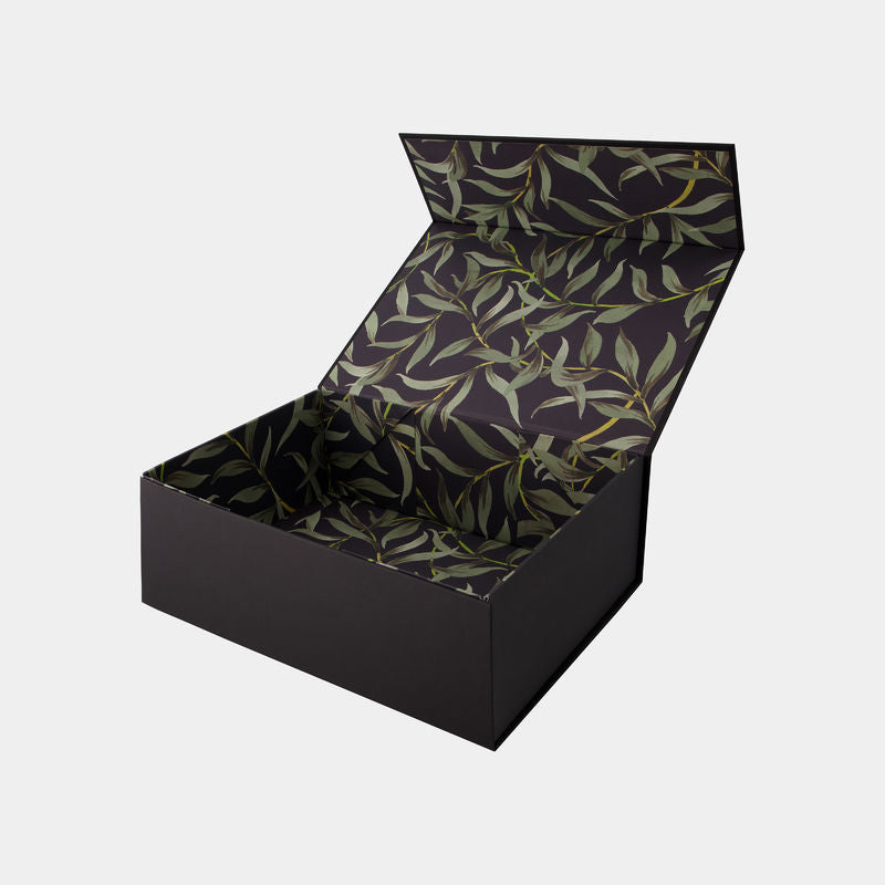 Model wears Gift Box Gift Packaging in FOLIAGE PRINT. On body side view