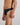 Model wears Cotton Stretch Mens Thong in BLACK. On body side view