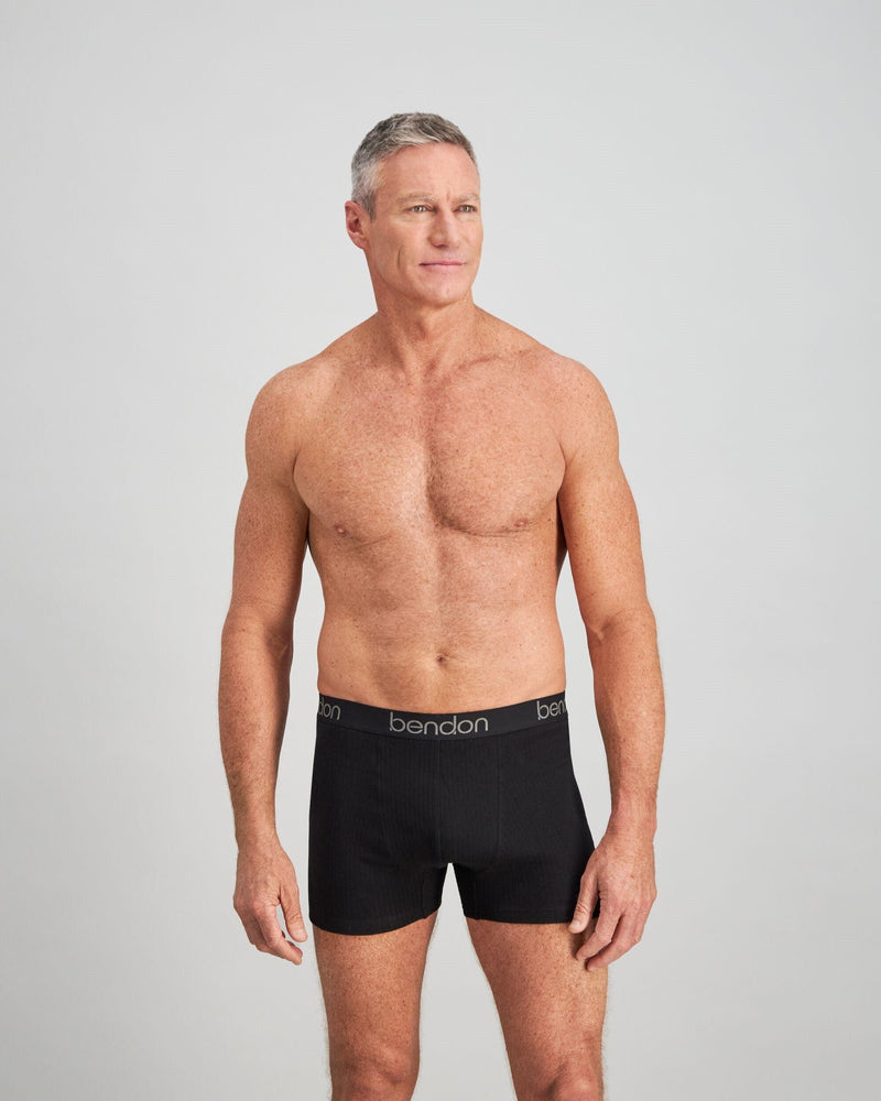 Model wears Cotton Texture Mens Trunk in BLACK. On body front view