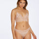 Model wears Captivate Me Thong in NUDE INTIME. On body front view