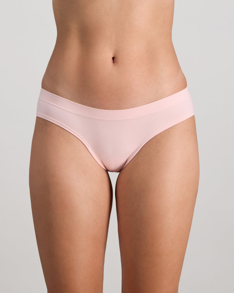 Model wears Seamless Soft Bikini in ICY PINK. On body front view