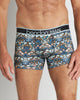 Model wears Retros Print Mens Trunk in TWISTED CLASSICS. On body front view