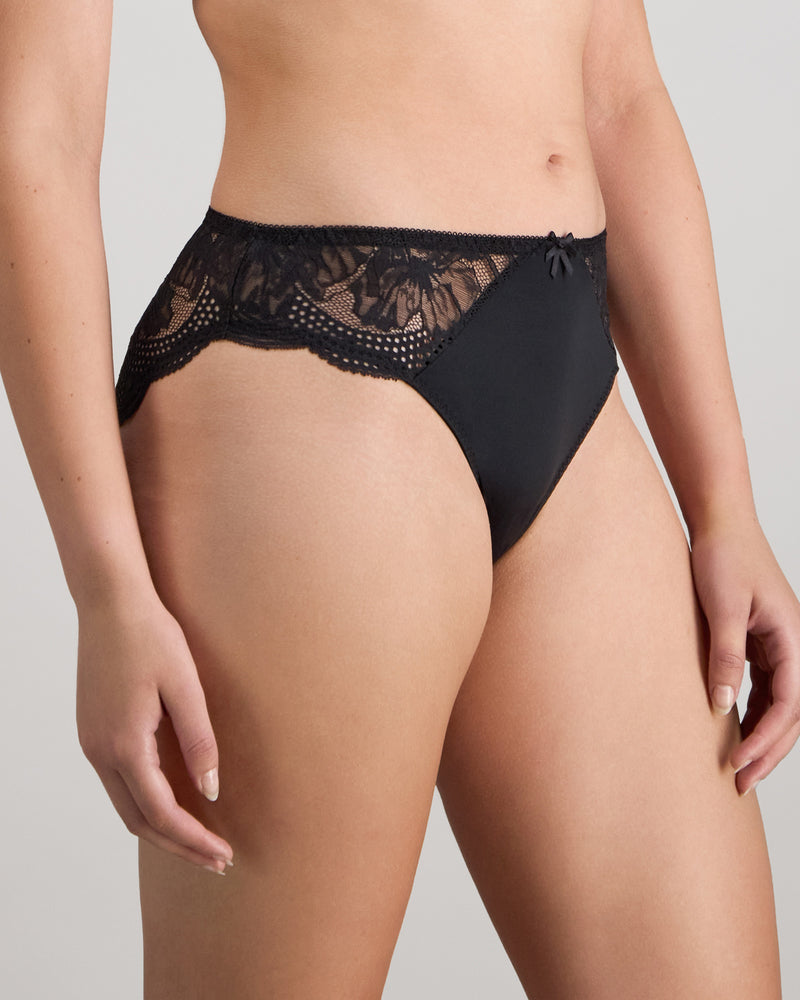 Model wears Aria High Cut Brief in BLACK. On body side view