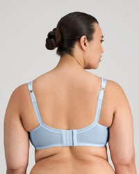 Model wears Charlotte Underwire Bra in SKYWAY. On body back view