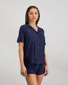 Model wears Belle Bamboo Short Pj Set in NAVY BLAZER. On body side view