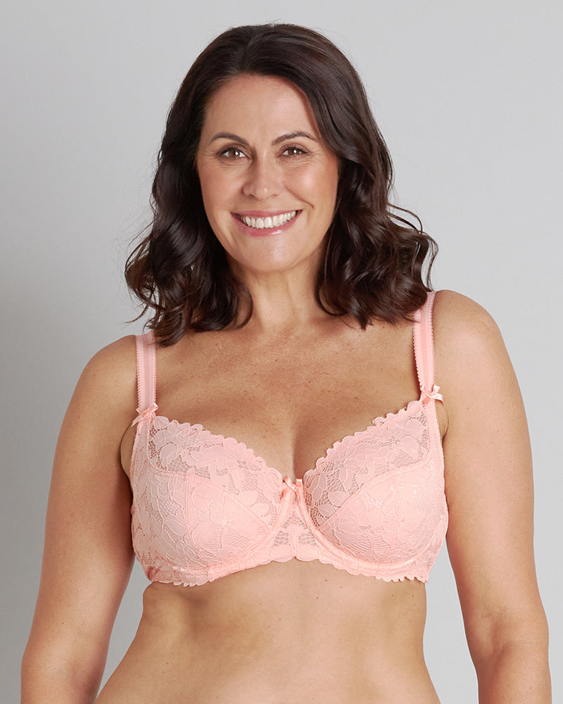 Model wears Alice Underwire Bra in PEACH BUD. On body front view