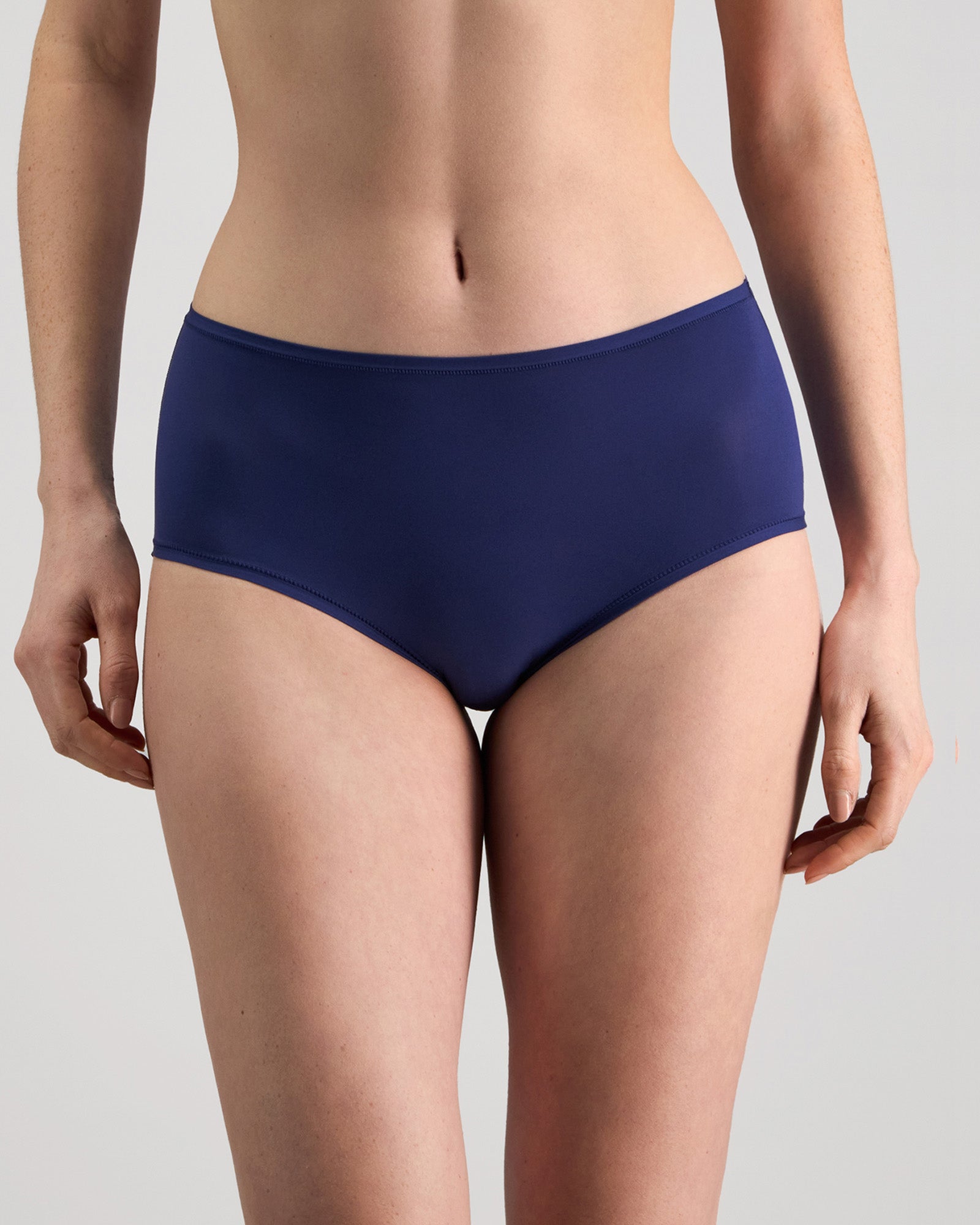 Model wears Extra-Ordinary Full Brief in Medieval Blue. On body front view