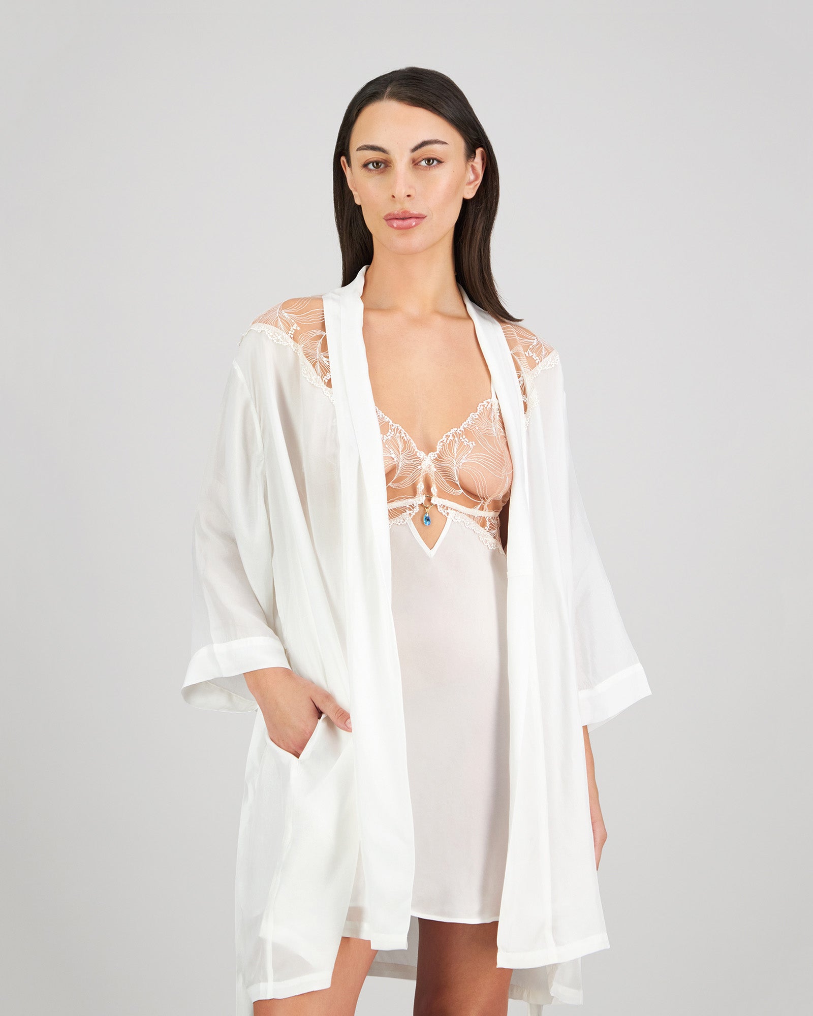 Model wears Eros Robe in SUGAR. On body front view