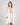 Model wears Eros Robe in SUGAR. On body front view