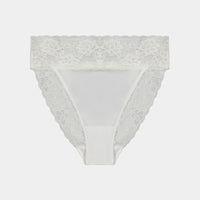 Model wears Lace Trim High Cut Brief in WHITE. On body front view