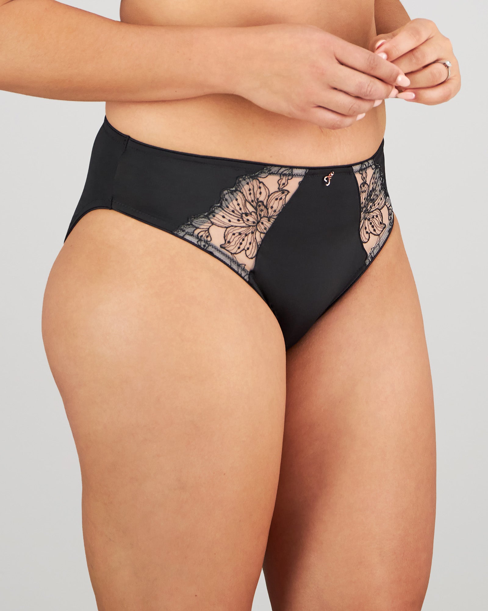 Model wears Magnetism High Cut Brief in BLACK/LATTE. On body side view