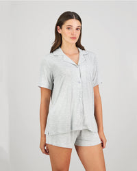 Model wears Belle Bamboo Short PJ in LIGHT GREY MARLE. On body side view