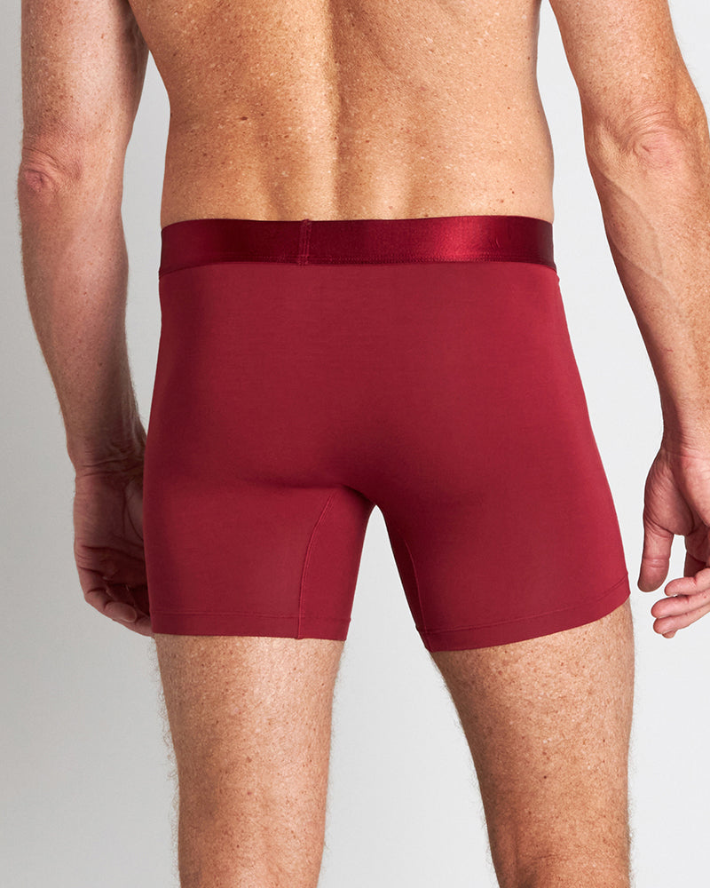 Model wears Bamboo Mens Trunk in BIKING RED. On body back view