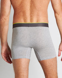 Model wears Everyday Active Mens Trunk in GREY MARL. On body back view
