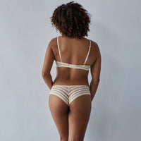 Model wears Morning Lola Underwire Bra in SCALLOP SHELL. On body back view