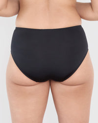 Model wears Castaway Midi in BLACK. On body back view