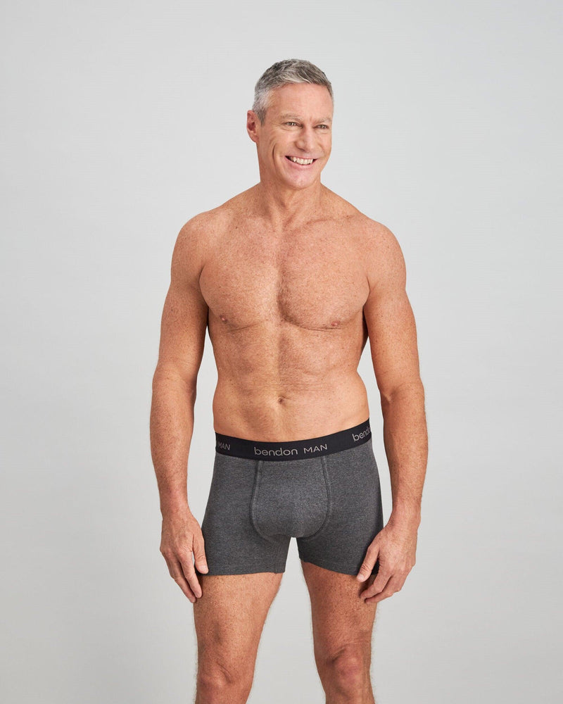 Model wears Cotton Classics Mens Trunk in GREY MARL. On body front view