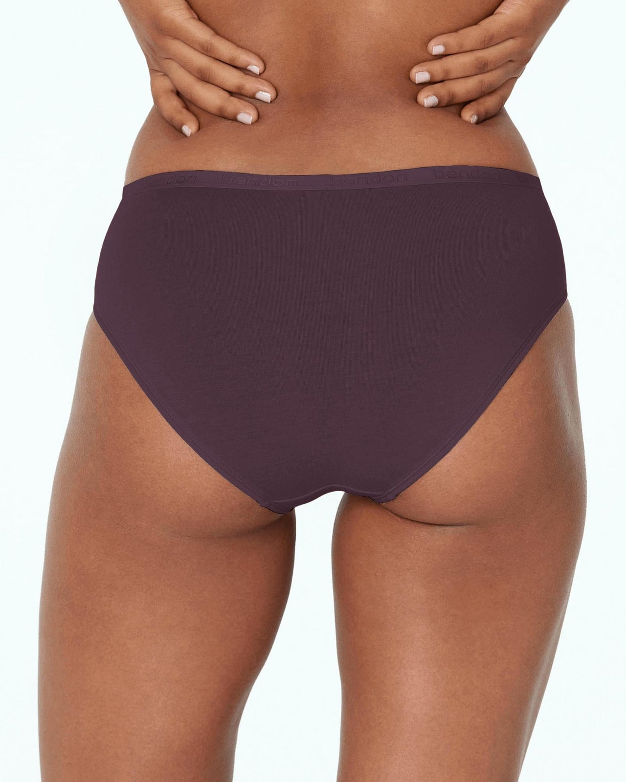 Model wears Body Cotton Bikini in PLUM PERFECT. On body back view