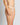 Model wears Olivia Luxe Thong in CHAMPAGNE. On body side view