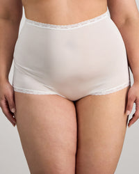 Model wears Nylon Tricot Full Brief in WHITE. On body front view