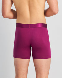 Model wears Bamboo Mens Trunk in MAGENTA PURPLE. On body back view