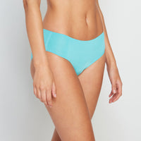 Model wears Perfectly Shapely Bikini in SCUBA BLUE. On body front view
