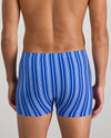 Model wears Cotton Stretch Mens Trunk in SURF THE WEB STRIPE. On body back view