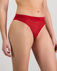 Model wears Lightweight High Cut Brief in SALSA. On body side view