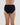 Model wears Stretch Cotton Full Brief in BLACK. On body back view
