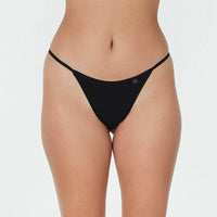 Model wears Clemence Thong in BLACK. On body front view