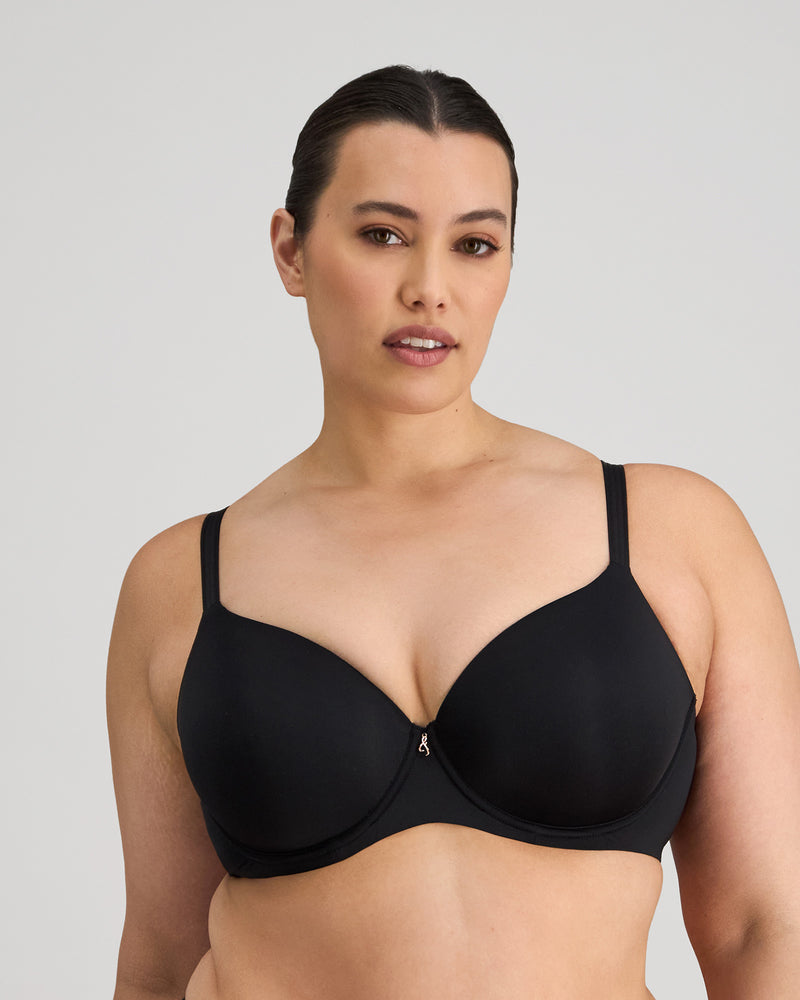 Model wears Sculpt Contour Bra in BLACK. On body front view