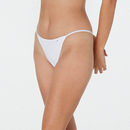 Model wears Clemence Thong in WHITE. On body front view