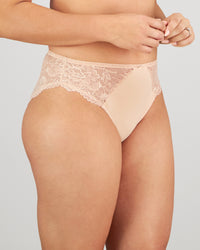 Model wears Laurel High Cut Brief in LATTE. On body side view