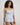 Model wears Smoothie Cami & Short Set in SKYWAY. On body side view