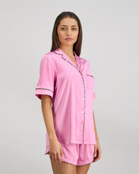 Model wears Holly Short PJ Set in FUCHSIA PINK. On body side view