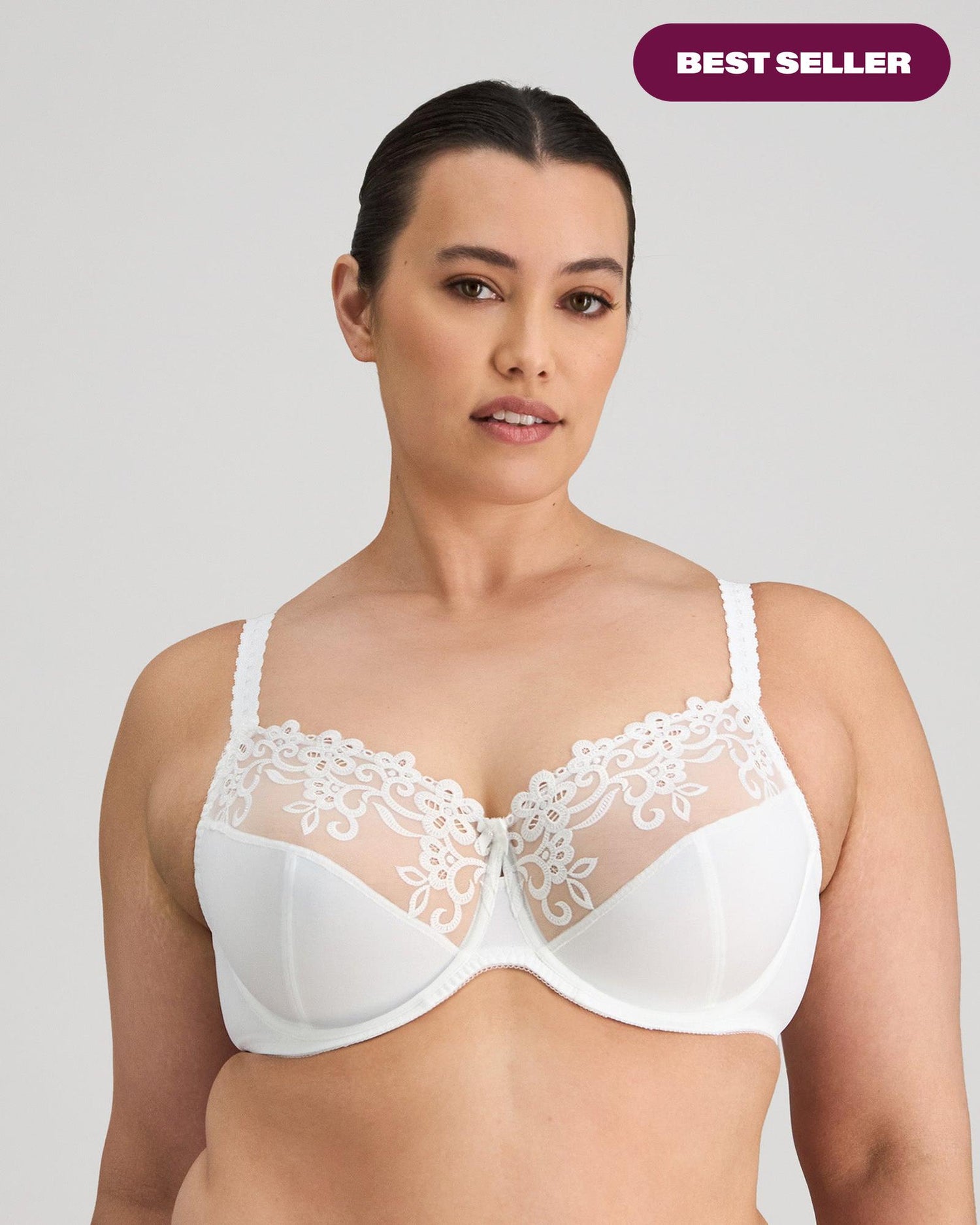 Model wears Coral Underwire Bra in WHITE. On body front view