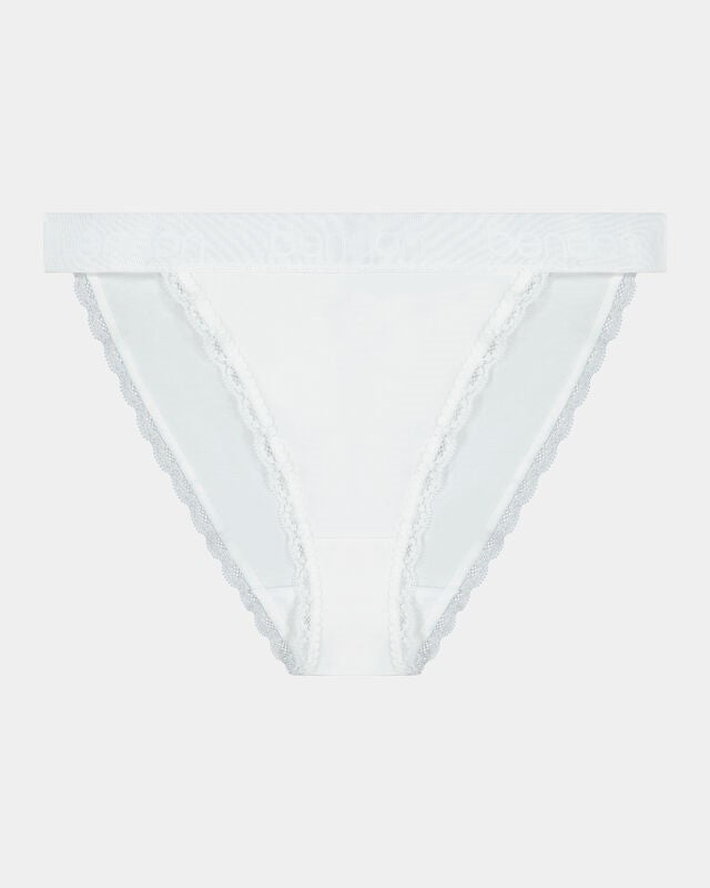 Model wears Cotton Logo Tanga in WHITE. On body front view