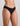 Model wears Extra-Ordinary Bikini in BLACK. On body side view