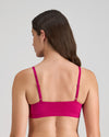 Model wears Extra-Ordinary Crop Top in FANTASY FUCHSIA. On body back view