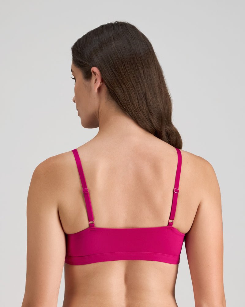 Model wears Extra-Ordinary Crop Top in FANTASY FUCHSIA. On body back view